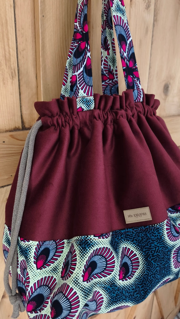 Maxi sac pochon en velours ras bordeaux et wax plume de paon– Fait main – Mlle Karapas Mlle Karapas