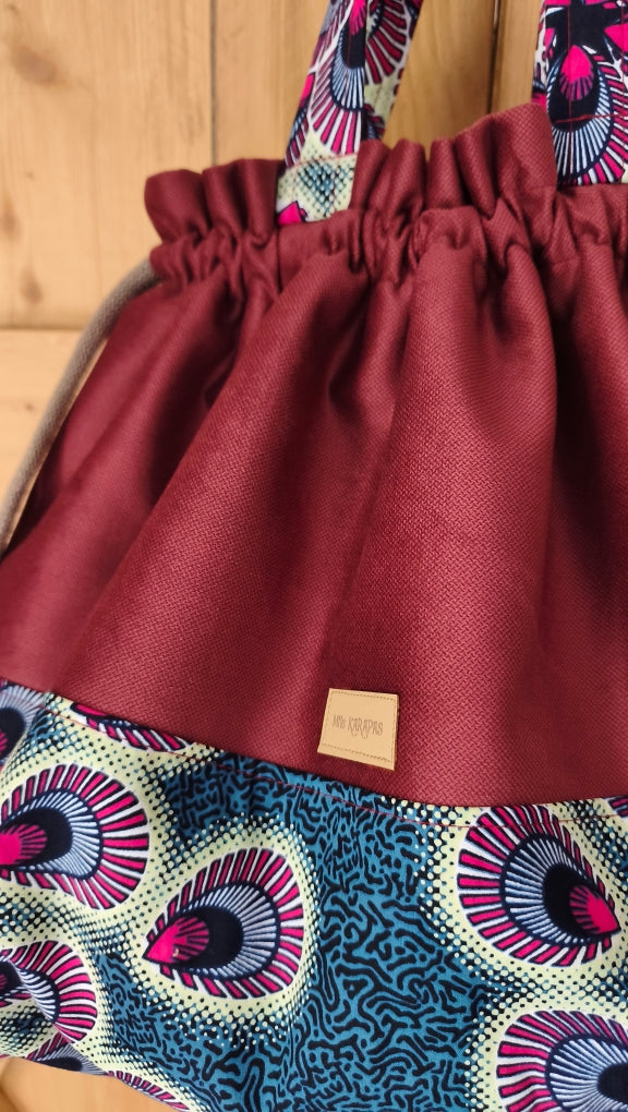 Maxi sac pochon en velours ras bordeaux et wax plume de paon– Fait main – Mlle Karapas Mlle Karapas