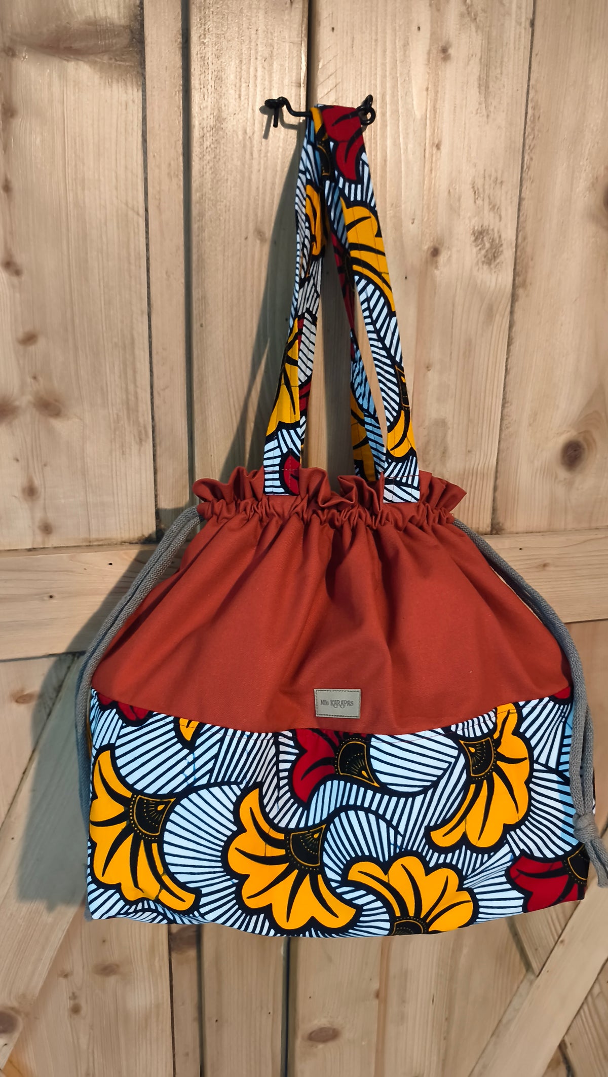 Maxi sac pochon en toile de coton terracotta et wax – Fait main – Mlle Karapas Mlle Karapas